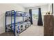 Fun ' bedroom with a blue bunk bed and playful bedding at 633 Cygnet Ln, Grayson, GA 30017