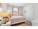 Bright bedroom with a comfy bed and plenty of natural light at 633 Cygnet Ln, Grayson, GA 30017
