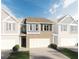 Two-story townhome with brick facade and attached garage at 633 Cygnet Ln, Grayson, GA 30017