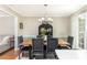 Charming dining room, featuring a wood table and six chairs at 12 Independence Nw Pl # 12, Atlanta, GA 30318