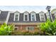 Brick townhome with dormers and lush landscaping at 12 Independence Nw Pl # 12, Atlanta, GA 30318