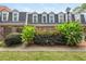 Back exterior of townhome with manicured lawn at 12 Independence Nw Pl # 12, Atlanta, GA 30318