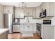 Modern kitchen with stainless steel appliances and gray cabinets at 12 Independence Nw Pl # 12, Atlanta, GA 30318