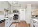 Modern kitchen features stainless steel appliances and white shaker cabinets at 12 Independence Nw Pl # 12, Atlanta, GA 30318