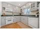 Eat-in kitchen with light gray cabinets and view to backyard at 1985 Seaboard Nw, Atlanta, GA 30318