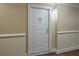 Hallway shot of unit 405 with neutral walls and trim at 200 River Vista Dr # 405, Atlanta, GA 30339