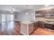 Open concept kitchen with hardwood floors and stainless steel appliances at 200 River Vista Dr # 405, Atlanta, GA 30339