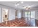 Hardwood floor living room with sliding glass doors at 200 River Vista Dr # 405, Atlanta, GA 30339