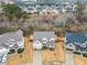 Aerial view of a house in a residential neighborhood at 1690 Geranium Ln, Cumming, GA 30040