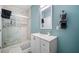 Basement bathroom with walk-in shower and white vanity at 1690 Geranium Ln, Cumming, GA 30040