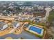 Aerial view of community pool and surrounding neighborhood at 1690 Geranium Ln, Cumming, GA 30040