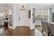 Entryway with hardwood floors, leading to home office and living spaces at 1690 Geranium Ln, Cumming, GA 30040