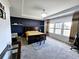 Spacious main bedroom with dark-colored walls, large windows, and plush carpet at 1690 Geranium Ln, Cumming, GA 30040