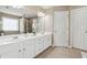 Double vanity bathroom with a large mirror and a shower at 3648 Ramsey Close Sw, Atlanta, GA 30331