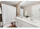 Bathroom with double sinks, shower/tub combo, and tile floor at 3648 Ramsey Close Sw, Atlanta, GA 30331