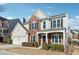 Two-story brick home with a large front yard and attached two-car garage at 3648 Ramsey Close Sw, Atlanta, GA 30331