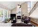 Gathering room with hardwood floors, fireplace, and vaulted ceiling at 3648 Ramsey Close Sw, Atlanta, GA 30331