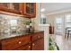 Kitchen features dark wood cabinets, granite countertops and a wine rack at 3648 Ramsey Close Sw, Atlanta, GA 30331