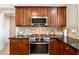 Kitchen features stainless steel appliances and granite countertops at 3648 Ramsey Close Sw, Atlanta, GA 30331