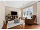 Living room with hardwood floors, large windows and comfortable seating at 3648 Ramsey Close Sw, Atlanta, GA 30331