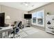 Home office with a desk, chair, and bookshelf at 3648 Ramsey Close Sw, Atlanta, GA 30331