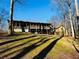 House back view with large deck and wooded area at 4350 Rockdale Dr, Acworth, GA 30101