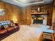 Living room features a brick fireplace and wood paneling at 4350 Rockdale Dr, Acworth, GA 30101