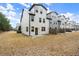 Townhouse backyard with patio and grass at 8775 Village Pl, Suwanee, GA 30024