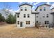 Townhouse backyard with patio and grass at 8775 Village Pl, Suwanee, GA 30024