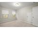 Bright bedroom with neutral walls, carpeting, and window at 8775 Village Pl, Suwanee, GA 30024