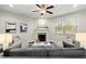 Cozy living room featuring a fireplace and comfortable seating at 8775 Village Pl, Suwanee, GA 30024