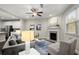 Living room with fireplace and seating area at 8775 Village Pl, Suwanee, GA 30024