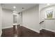 Spacious upper hallway with dark hardwood floors and access to bedrooms at 8775 Village Pl, Suwanee, GA 30024