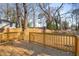 Spacious deck overlooks fenced backyard with mature trees at 942 Lawton Sw St, Atlanta, GA 30310