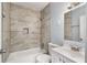 Updated bathroom with modern tile and a bathtub at 942 Lawton Sw St, Atlanta, GA 30310