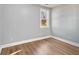 Simple bedroom with grey walls and wood-look floors at 942 Lawton Sw St, Atlanta, GA 30310