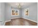 Charming bedroom with hardwood floors and two windows at 942 Lawton Sw St, Atlanta, GA 30310