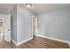 Well-lit bedroom with hardwood floors and access to other rooms at 942 Lawton Sw St, Atlanta, GA 30310