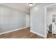 Bright bedroom with wood-look floors and an adjacent bathroom at 942 Lawton Sw St, Atlanta, GA 30310