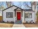 Newly renovated white house with red door, steps and walkway at 942 Lawton Sw St, Atlanta, GA 30310