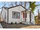 Newly renovated white house with red door, steps and walkway at 942 Lawton Sw St, Atlanta, GA 30310