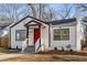 Newly renovated white house with red door, steps and walkway at 942 Lawton Sw St, Atlanta, GA 30310