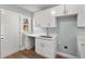 Modern kitchen with white cabinets and quartz countertops at 942 Lawton Sw St, Atlanta, GA 30310