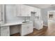 Modern kitchen with white cabinets and quartz countertops at 942 Lawton Sw St, Atlanta, GA 30310