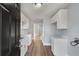 Modern kitchen with white cabinets and quartz countertops at 942 Lawton Sw St, Atlanta, GA 30310