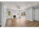 Bright living room featuring hardwood floors, fireplace, and neutral wall colors at 942 Lawton Sw St, Atlanta, GA 30310