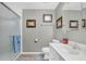 Clean bathroom with a white vanity, shower, and gray walls at 2751 Maeve Ct, Dacula, GA 30019