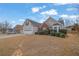 House exterior showcasing a two-car garage and partially visible driveway at 2751 Maeve Ct, Dacula, GA 30019