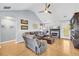 Spacious living room featuring hardwood floors, a cozy fireplace, and ample natural light at 510 Firethorn Ct, Villa Rica, GA 30180