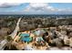 Aerial view of community with lake, pool, and tennis courts at 2057 Chambord Way, Snellville, GA 30078